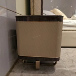 Dark Glossy Nightstand with Woven Leather Side Panels and Hidden Drawer Pulls